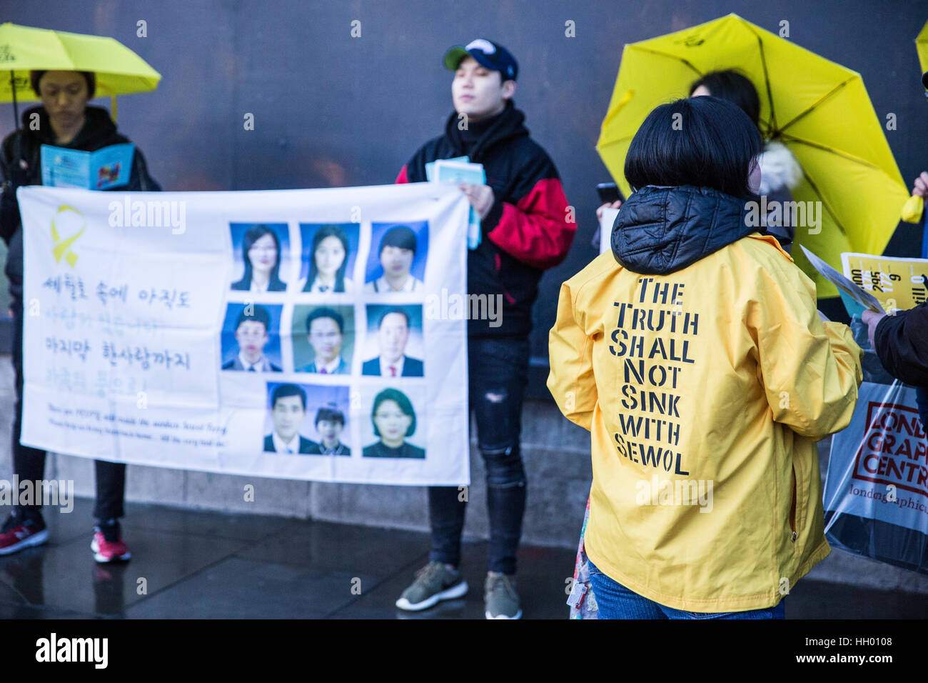 London, UK. 14th January, 2017. Members of the UK's Korean community hold a silent protest in Trafalgar Square to mark 1,000 days since the Sewol ferry disaster, to remember the victims and to demand that the Korean government not only raises the ferry without dismantling it to enable a thorough inquiry and recovery of all missing victims but also punishes those responsible and enacts anti-disaster regulations in London, UK. Credit: Mark Kerrison/Alamy Live News Stock Photo