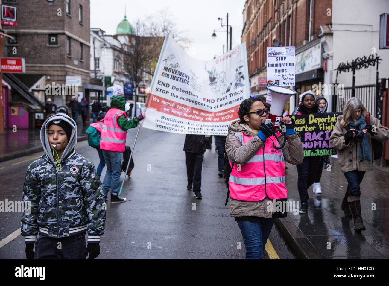 London, UK. 14th January, 2017. Campaigners from Movement For Justice By Any Means Necessary, including Antonia Bright (c), protest in Brixton against mass deportation charter flights to Nigeria, Ghana, Jamaica, Pakistan and Afghanistan used by the British Government in London, UK. Credit: Mark Kerrison/Alamy Live News Stock Photo