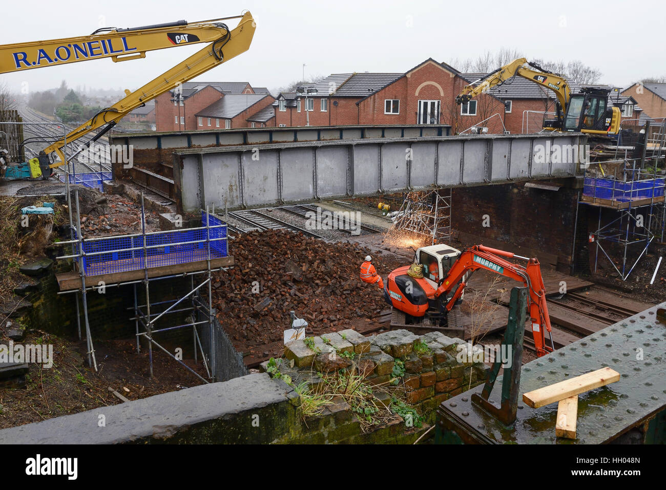 Chester, UK. 15th January 2017. Removal of the final sections of an old railway bridge on Brook Lane over the Merseyrail Wirral Line in Chester, UK ©Andrew Paterson / Alamy Live News Stock Photo