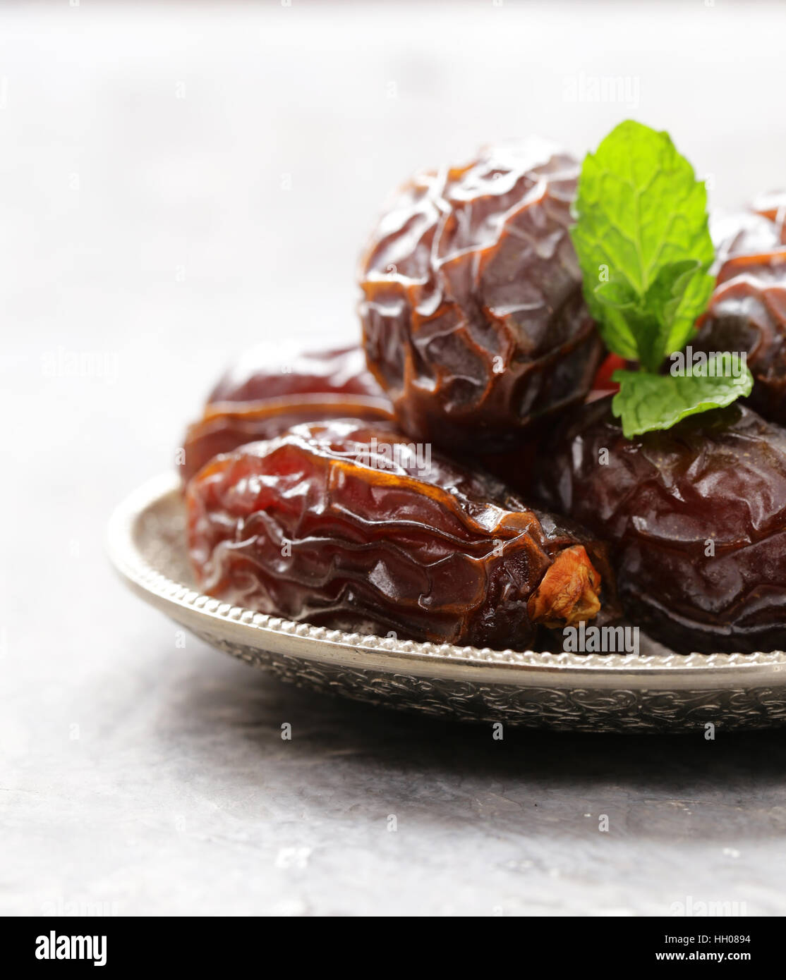 Sweet dried figs dates in a plate on the table Stock Photo Alamy