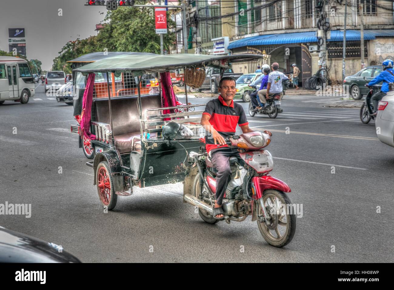 A friendly tuk-tuk driver in Phnom Penh, Cambodia. Stock Photo