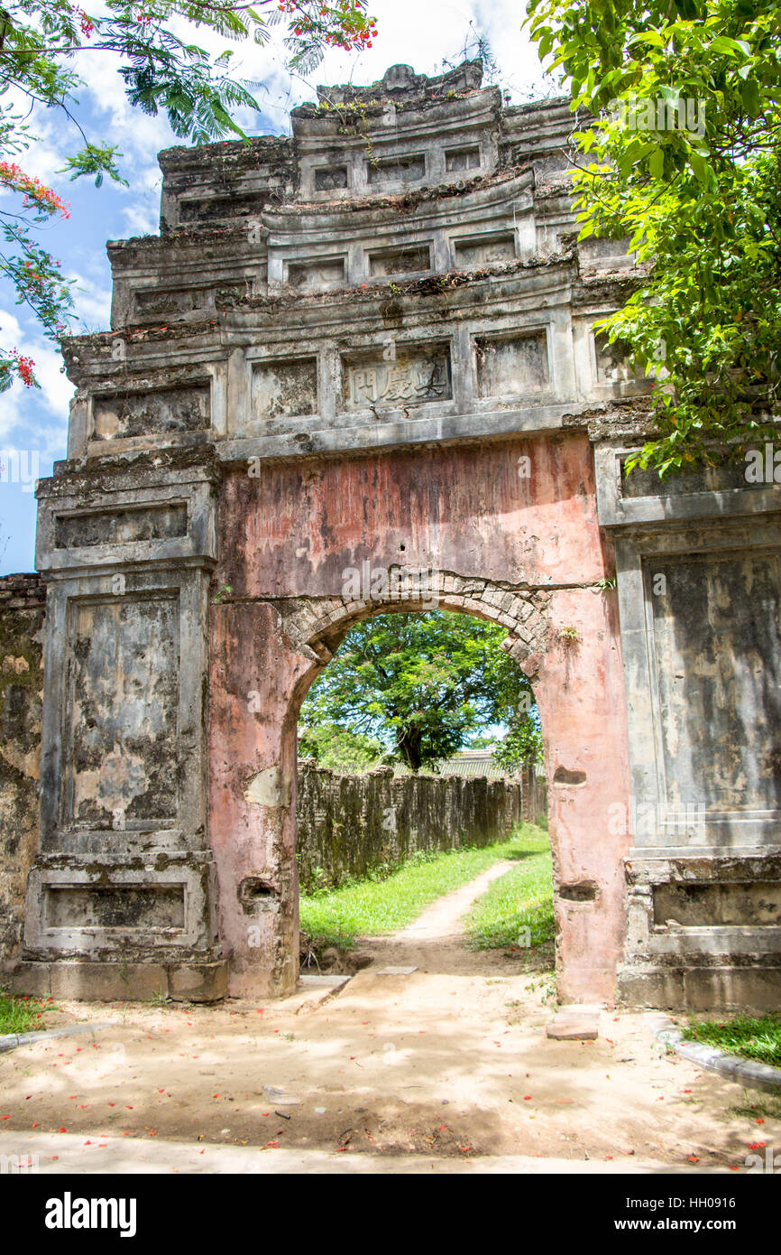 The ruins of an old weathered entrance gate in the walled Citadel and Imperial Palace in Hue.  Its is a UNESCO World Heritage. Stock Photo