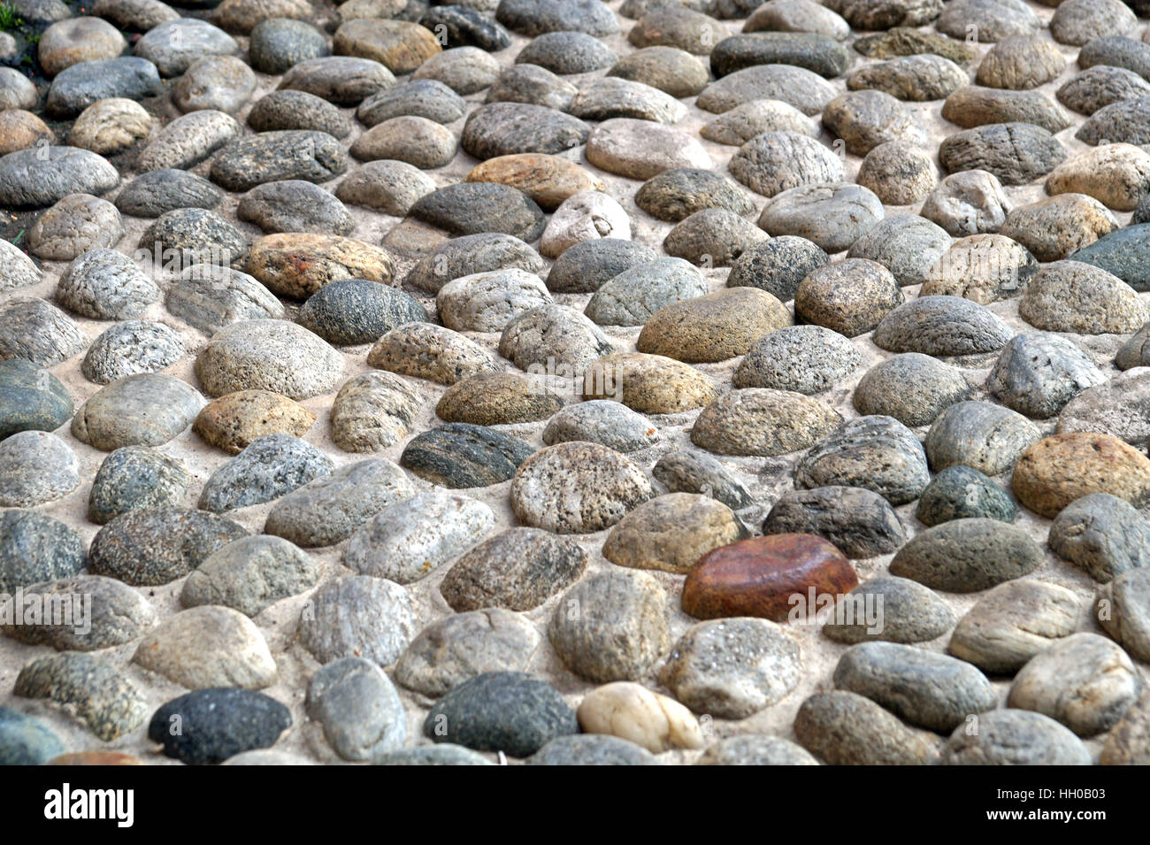 Pebble stone texture wall and seamless background Stock Photo