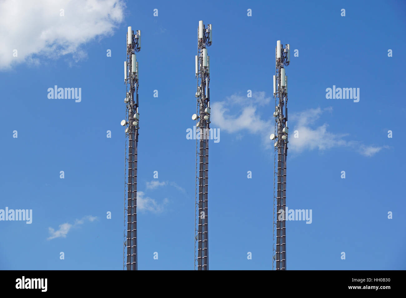 structure tower of cell phone antenna with blue sky Stock Photo