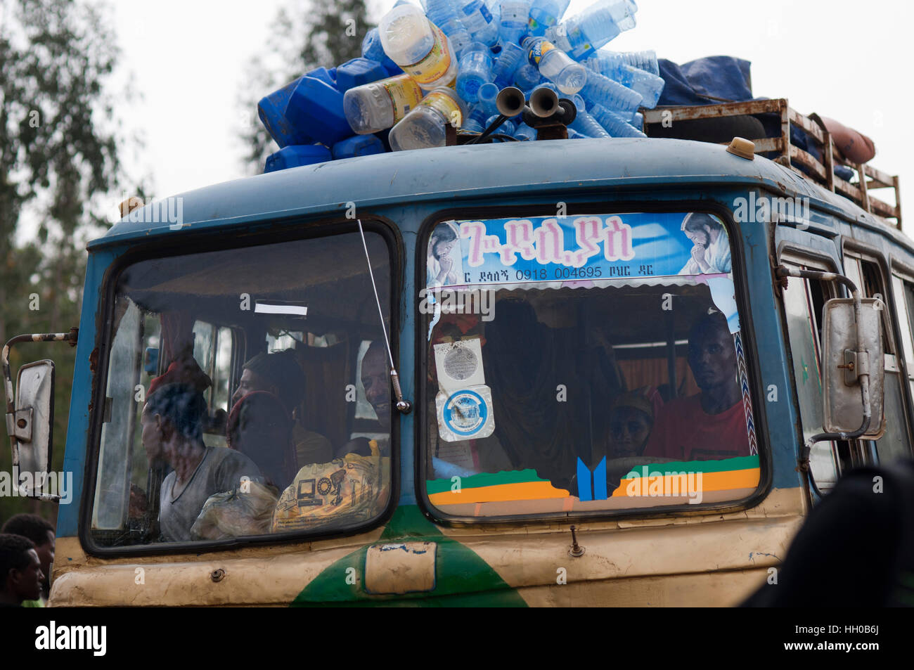 Tis Isat or Blue Nile waterfalls, Bahar Dar, Ethiopia, Africa.  One of the typical buses of Ethiopia crammed with people and everything that can be tr Stock Photo