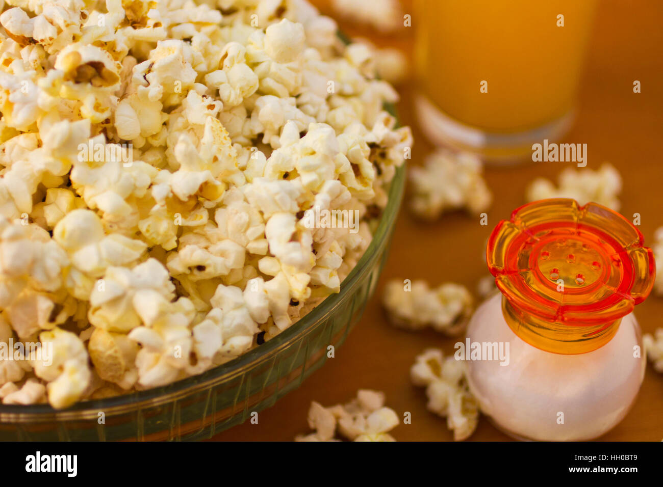 Popcorn and juice on wooden table closeup Stock Photo Alamy