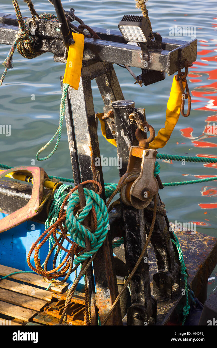 Close up shots of a trawler's deck equipment including navigation lights, ropes, markers and beacons Stock Photo