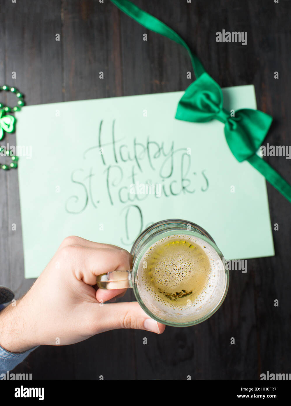 Man drinking beer and celebrating St Patrick day  close up Stock Photo