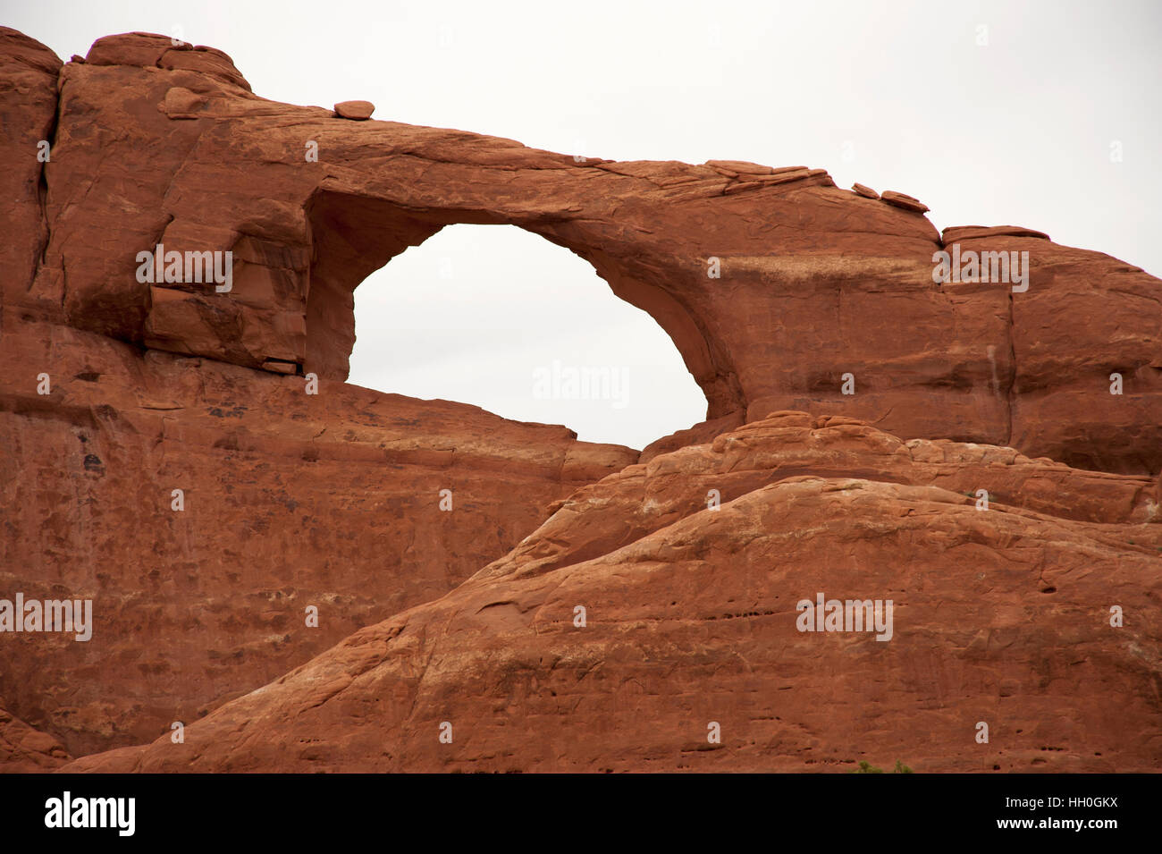 Skyline Arch  in Arches National Park, red sandstone rock where erosion caused the arch to form as interior rocks fell away Stock Photo