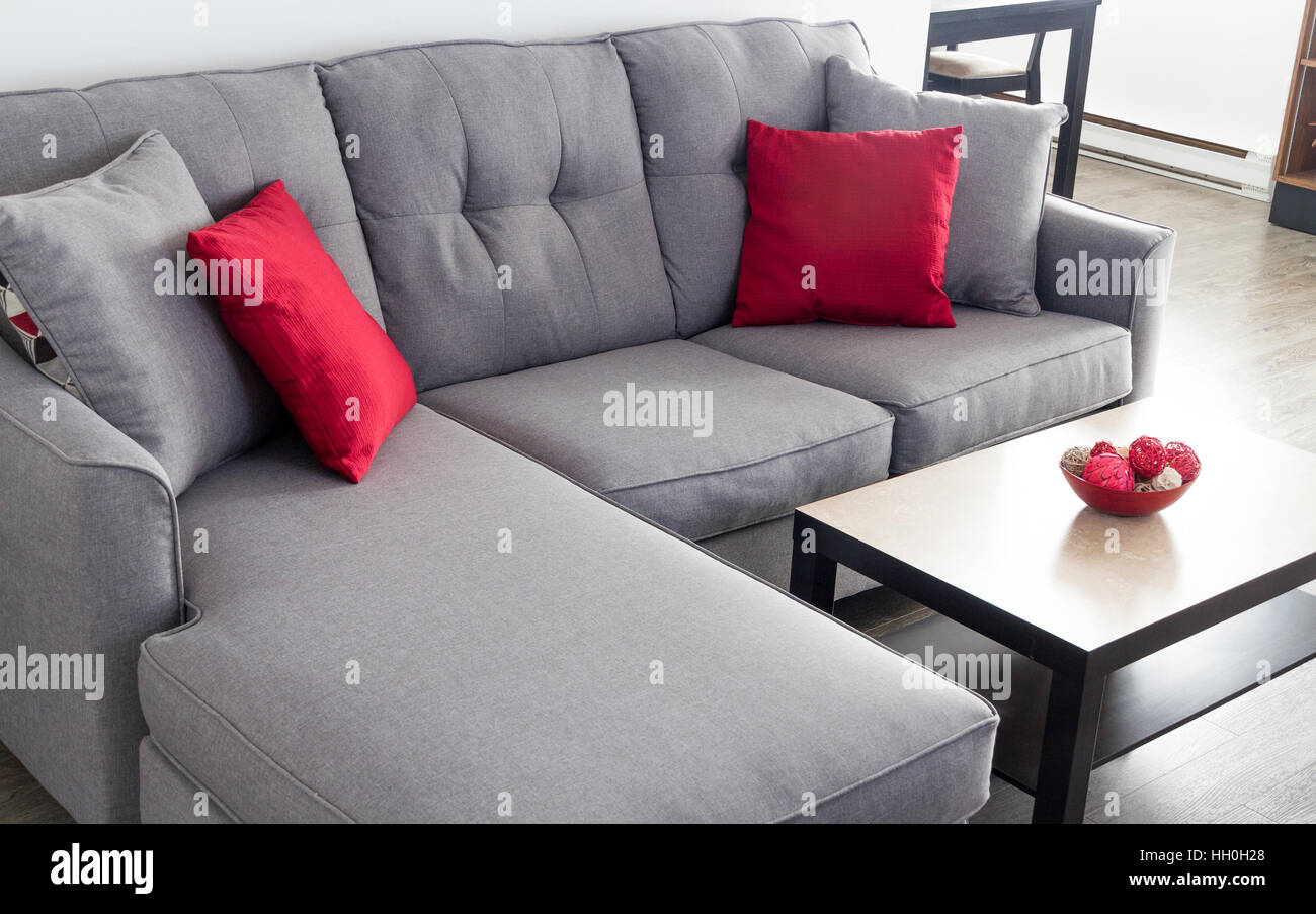 appartment living room interior with couch and cofee table at sunlight Stock Photo