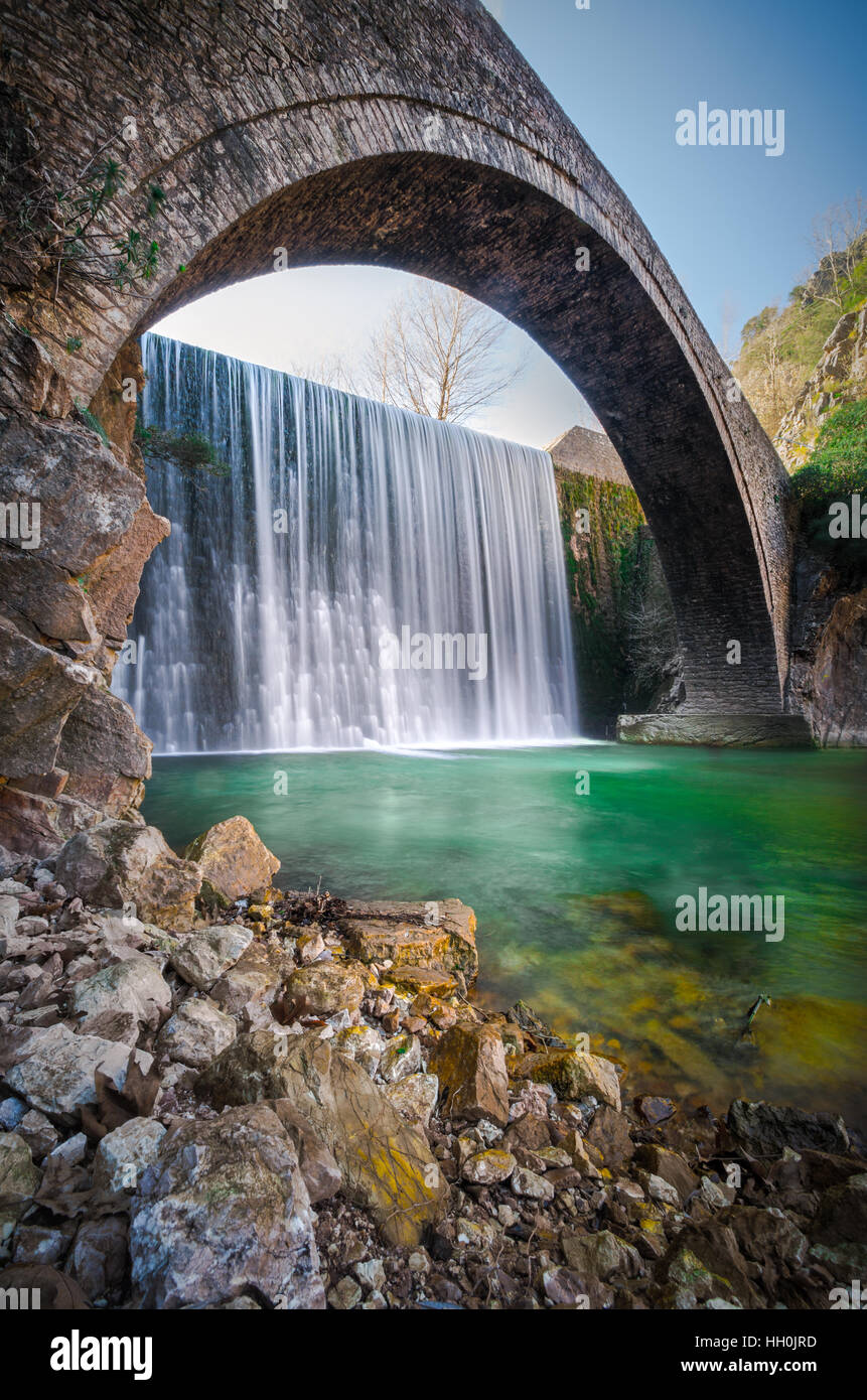 Paleokarya, old, stone, arched bridge, between two waterfalls. Trikala prefecture, Thessaly, Greece Stock Photo