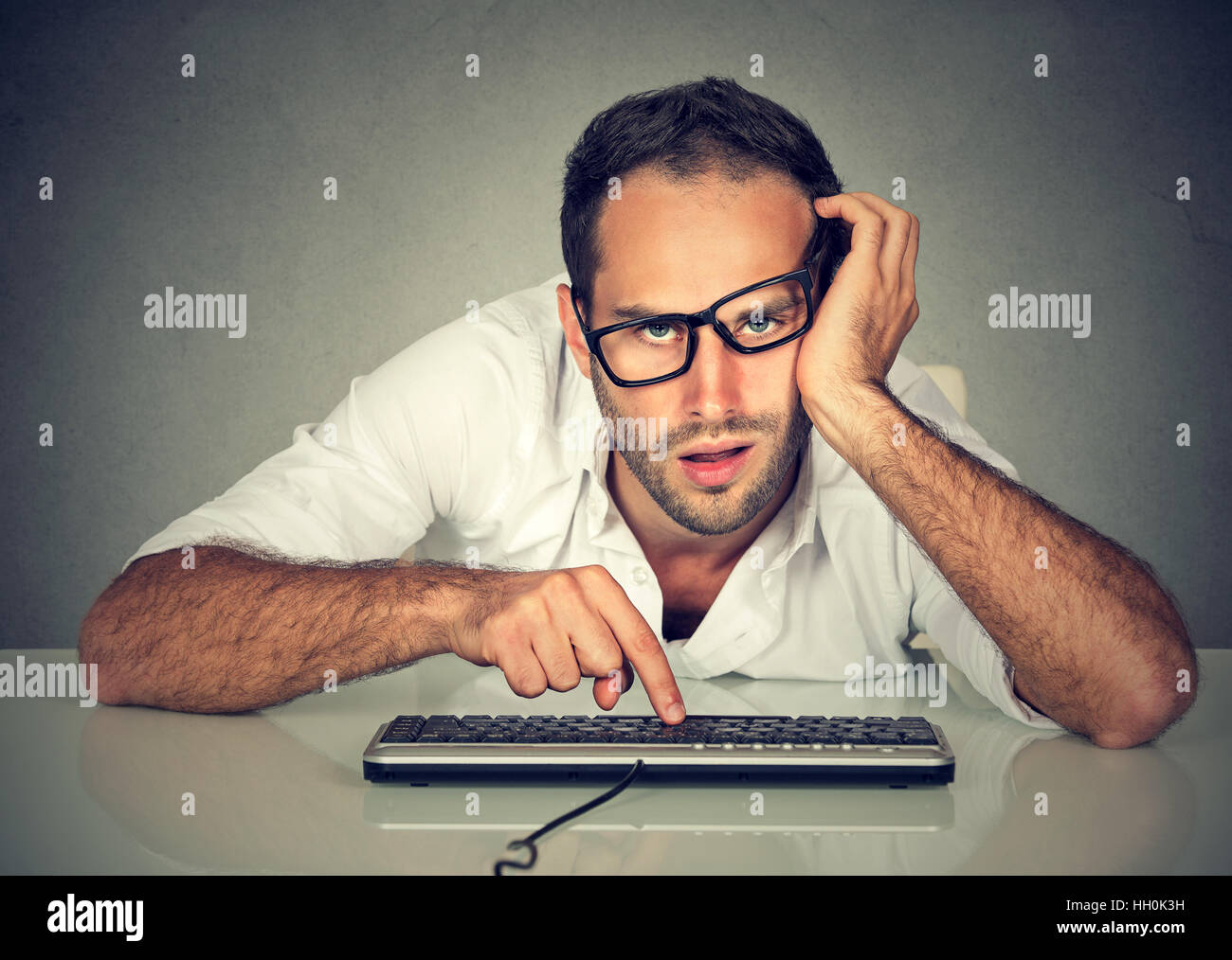 Overworked man working on computer hi-res stock photography and images ...