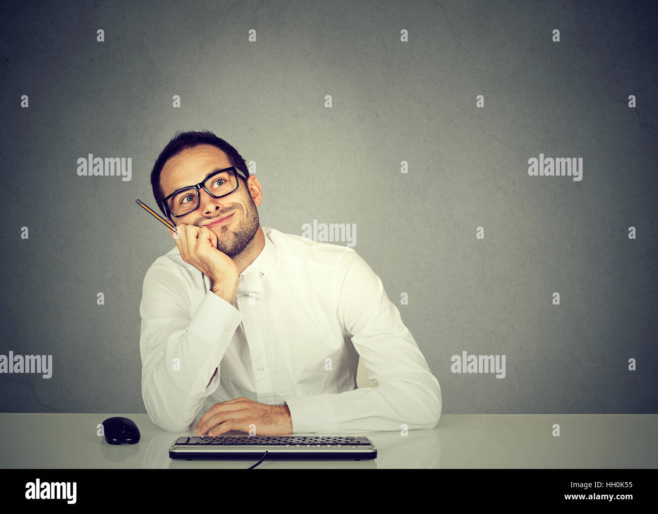 young funny business man thinking daydreaming Stock Photo