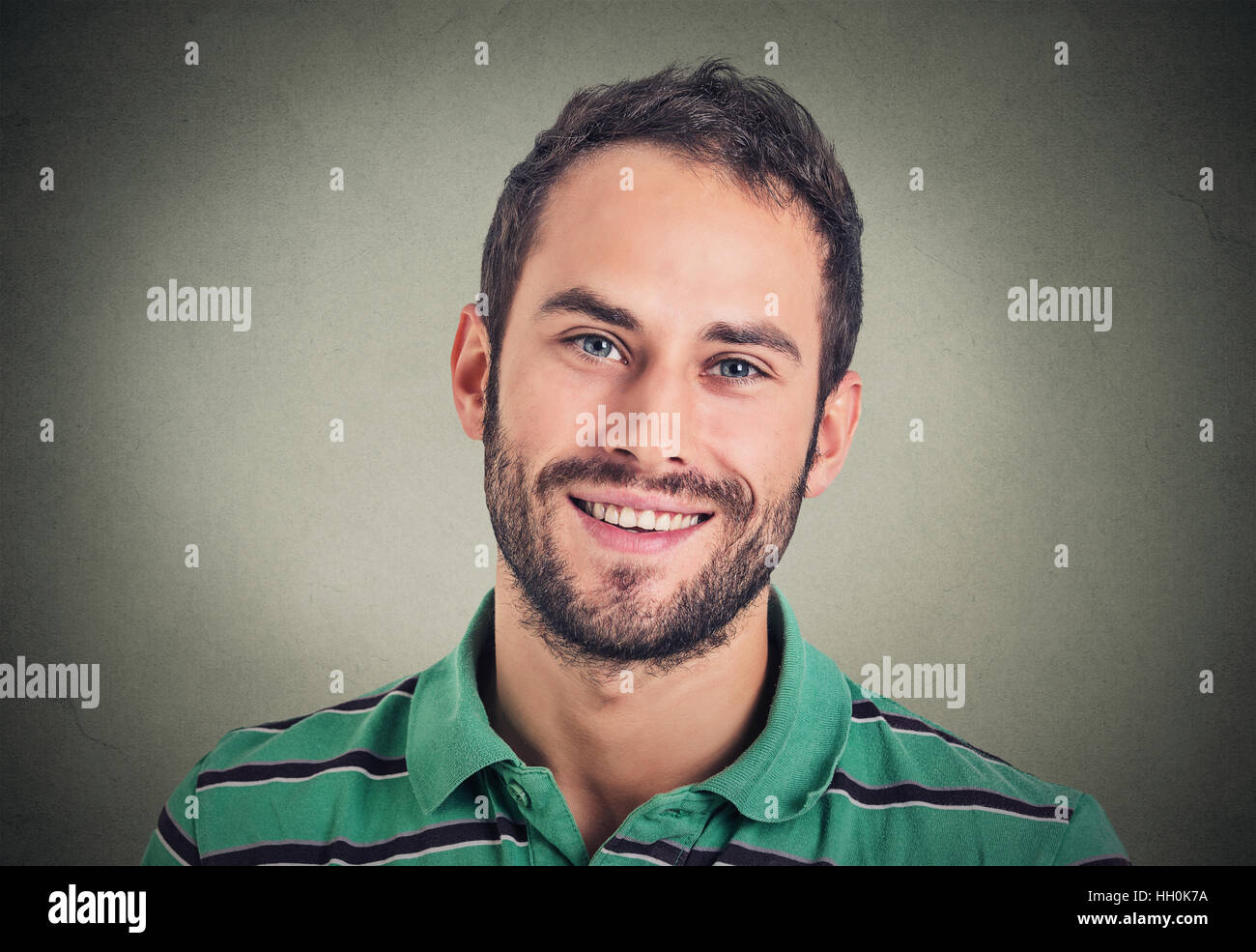 Headshot smiling modern man, creative professional isolated on gray wall background Stock Photo