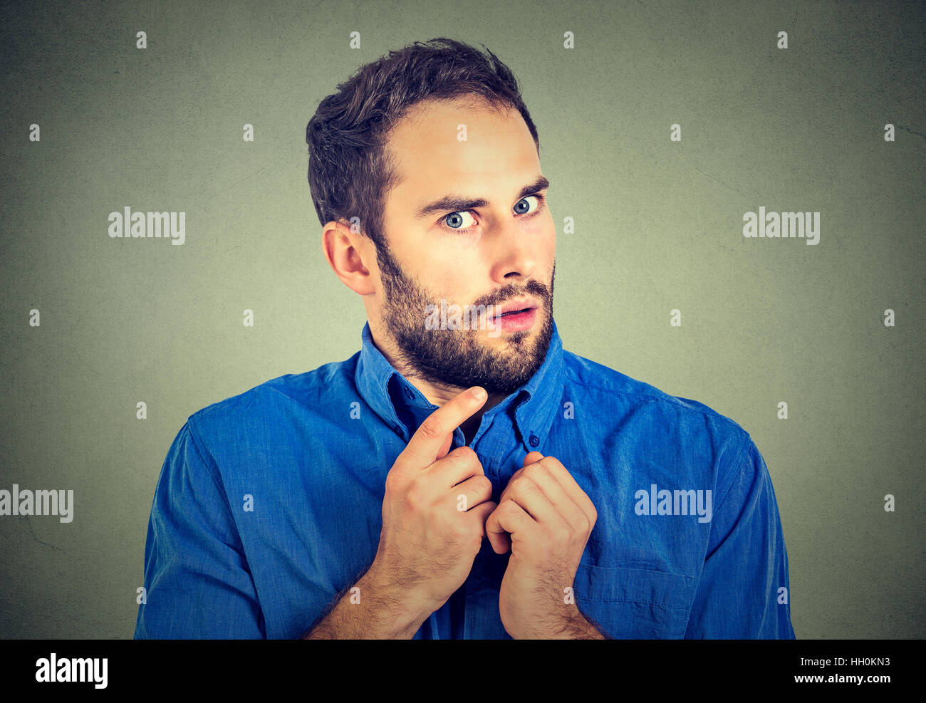 Suspicious worried young man Stock Photo
