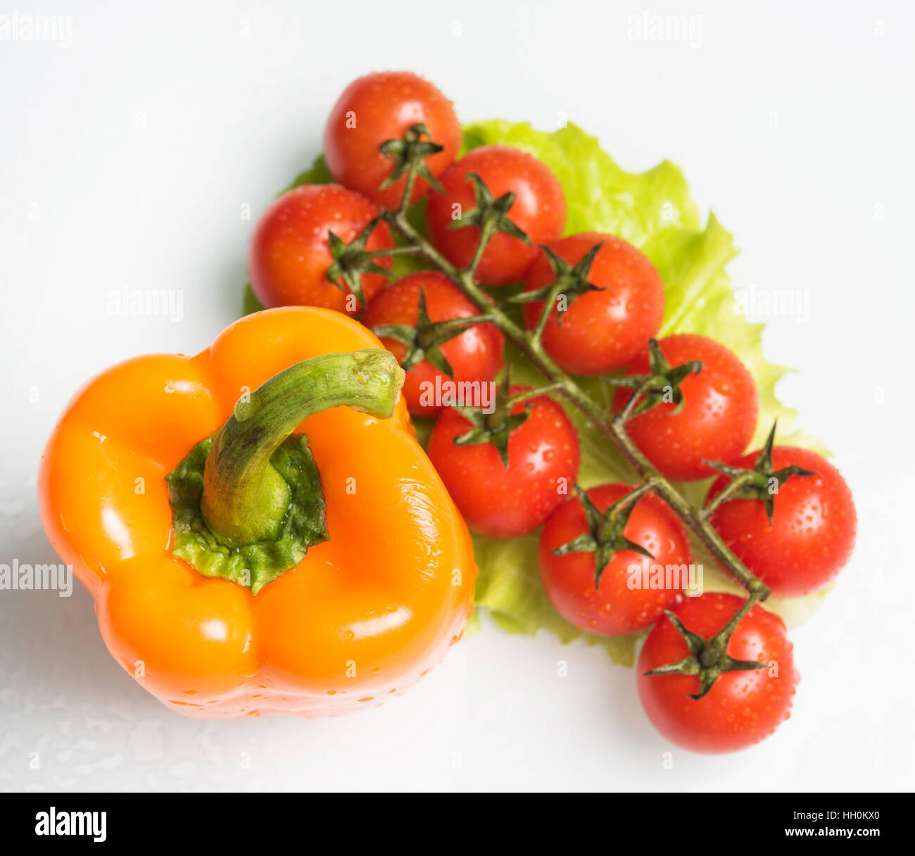 bell pepper with a sprig of tomatoes Stock Photo