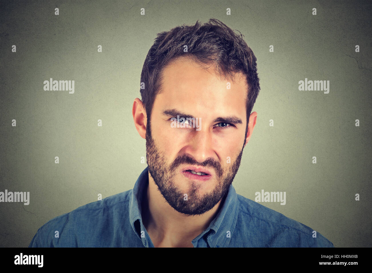 Annoyance. Angry displeased young man Stock Photo