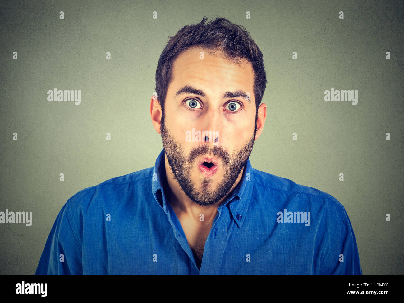 Shocked Man Isolated On Gray Wall Background Stock Photo Alamy