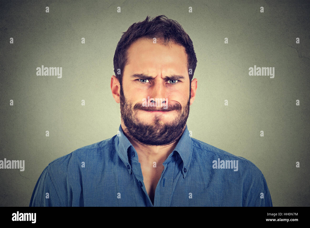 Closeup portrait of angry young man about to have nervous breakdown ...