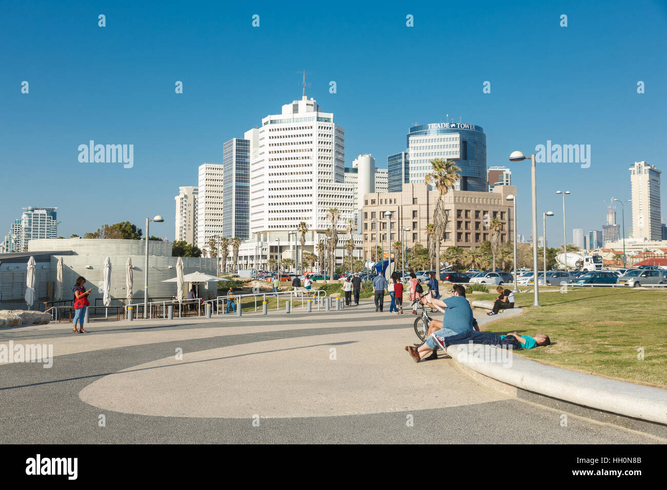 TEL AVIV,ISRAEL - April 4, 2016 : Coastline view on the Textile and Fashion Center, Trade Tower and walking people from Jaffa side  in Tel Aviv, Israe Stock Photo