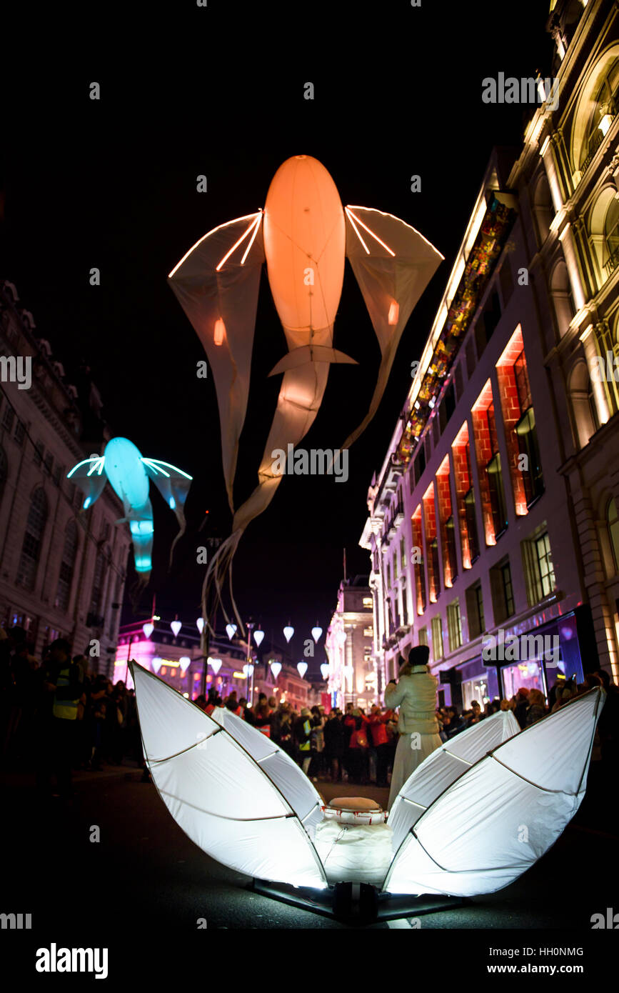 The fish-like illuminated kites - 'Les Luminéoles' by art group Porté par le vent, Lumiere Light Festival, London Stock Photo