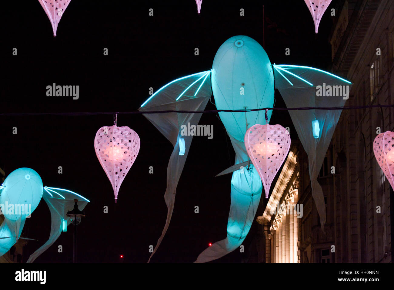 The fish-like illuminated kites - 'Les Luminéoles' by art group Porté par le vent, Lumiere Light Festival, London. Stock Photo