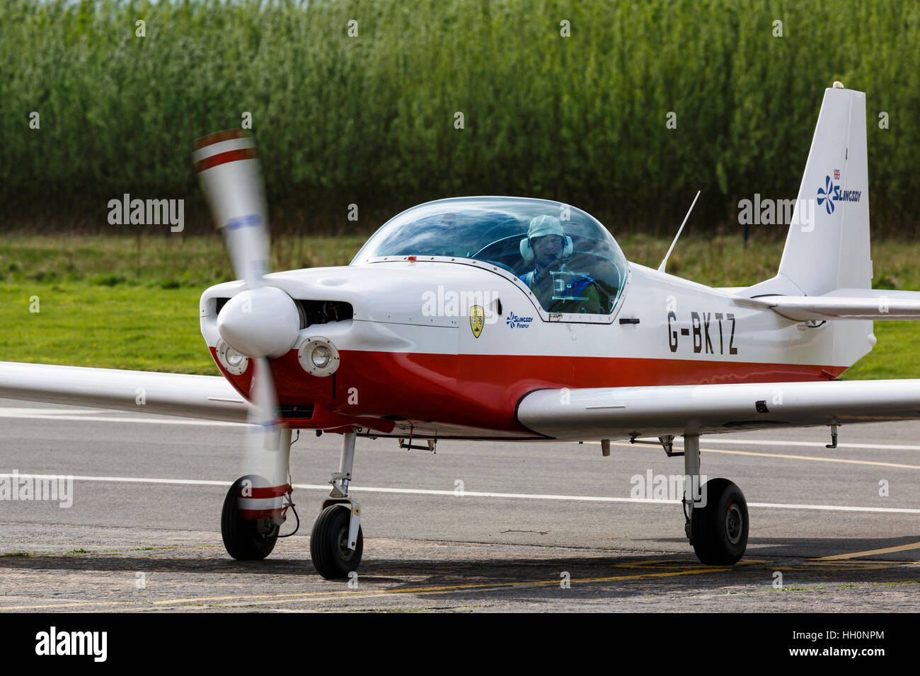 Slingsby T67M Firefly G-BKTZ taxiing from runway at Sandtoft Airfield ...