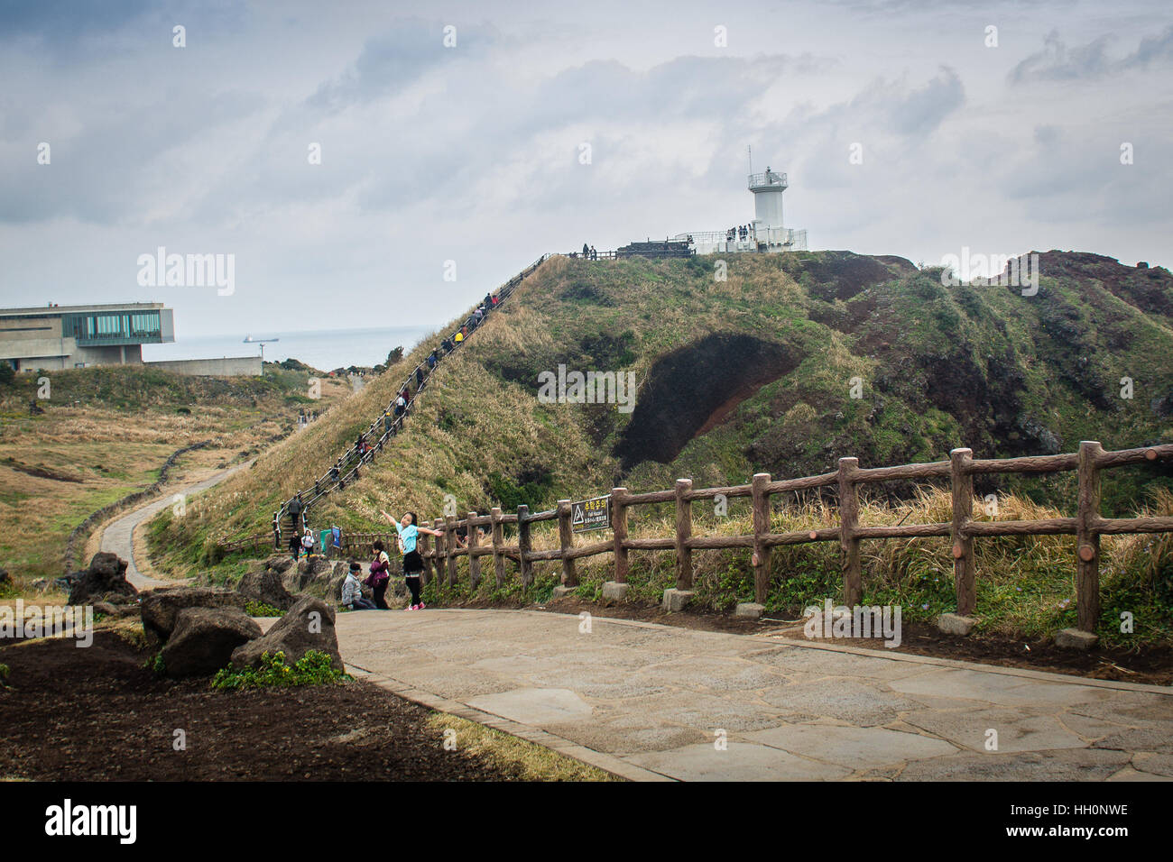 Jeju Island, Korea - November 13, 2016 : The tourist visited Lighthouse, the target of treking in Seopjikoji. Located at the end of the Eastern shore  Stock Photo