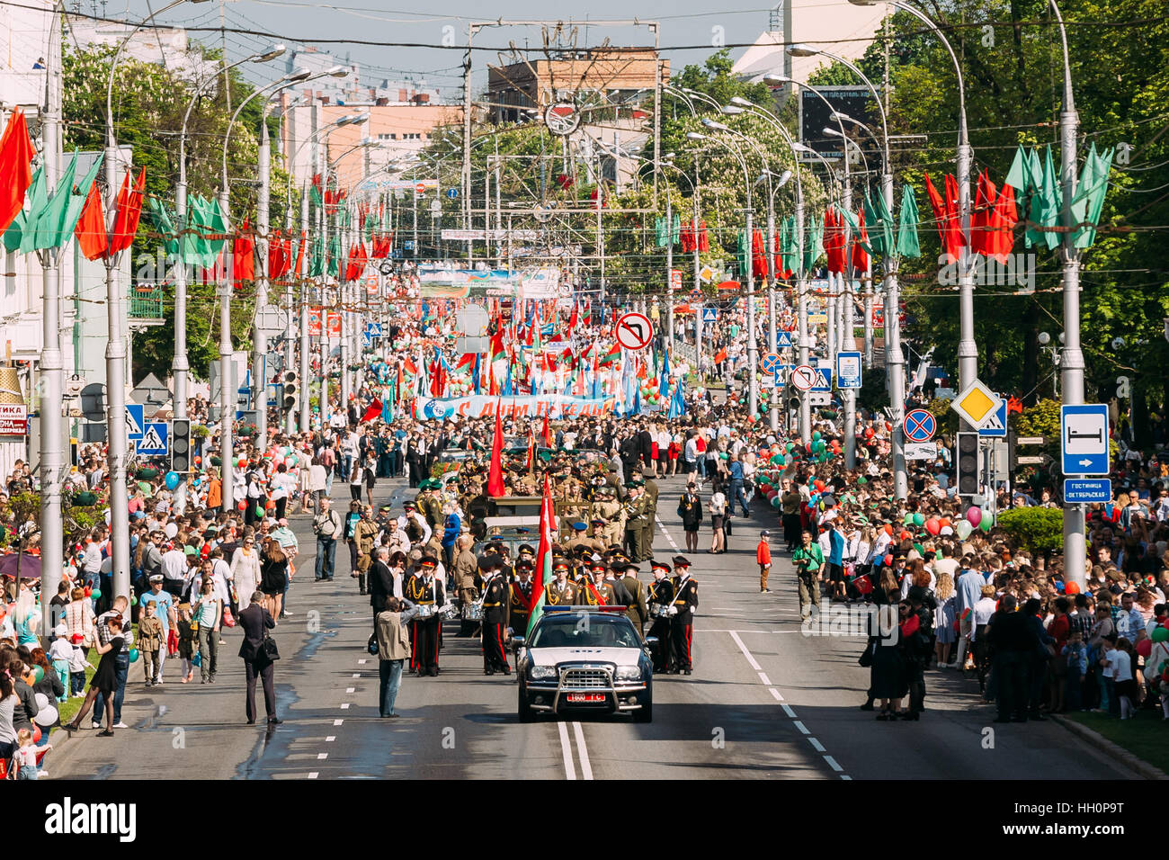 Gomel, Belarus - May 9, 2016: The Ceremonial Procession Of Parade. Military, Civilian People And Enginery On The Festive Decorated Street. Celebration Stock Photo