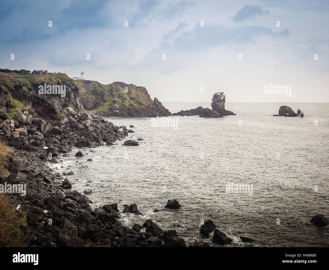 Lighthouse, the target of treking in Seopjikoji. Located at the end of the Eastern shore of Jeju island, South Korea Stock Photo