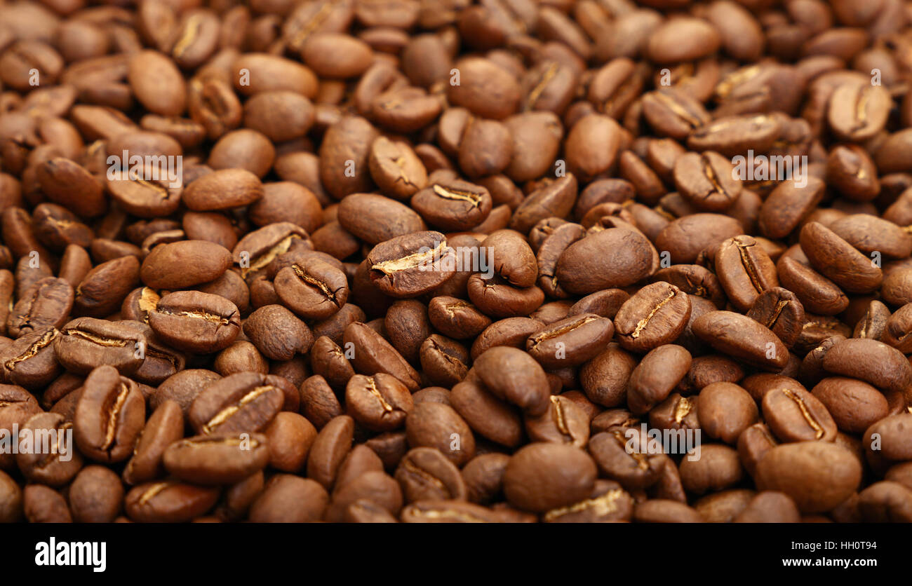 Roasted brown Arabica coffee big beans background pattern, close up ...