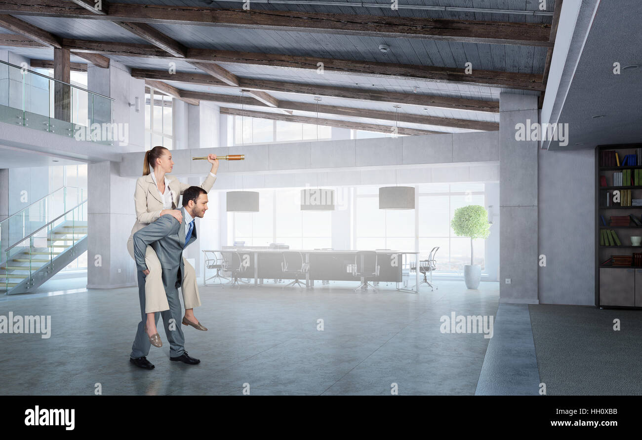 Businesspeople in office riding colleague back. Mixed media Stock Photo ...