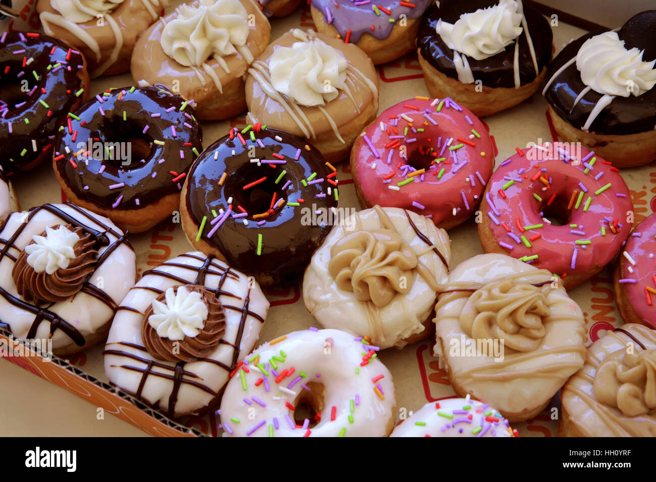 Sugar coated colorful doughnuts Stock Photo