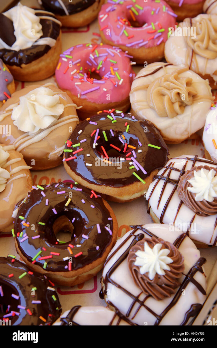 Sugar coated colorful doughnuts Stock Photo