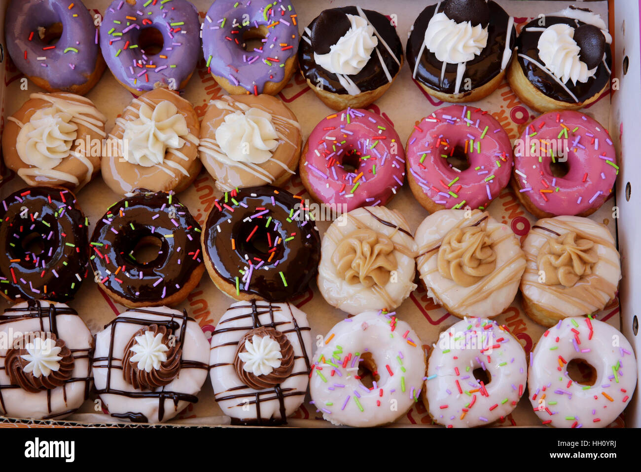 Sugar coated colorful doughnuts Stock Photo