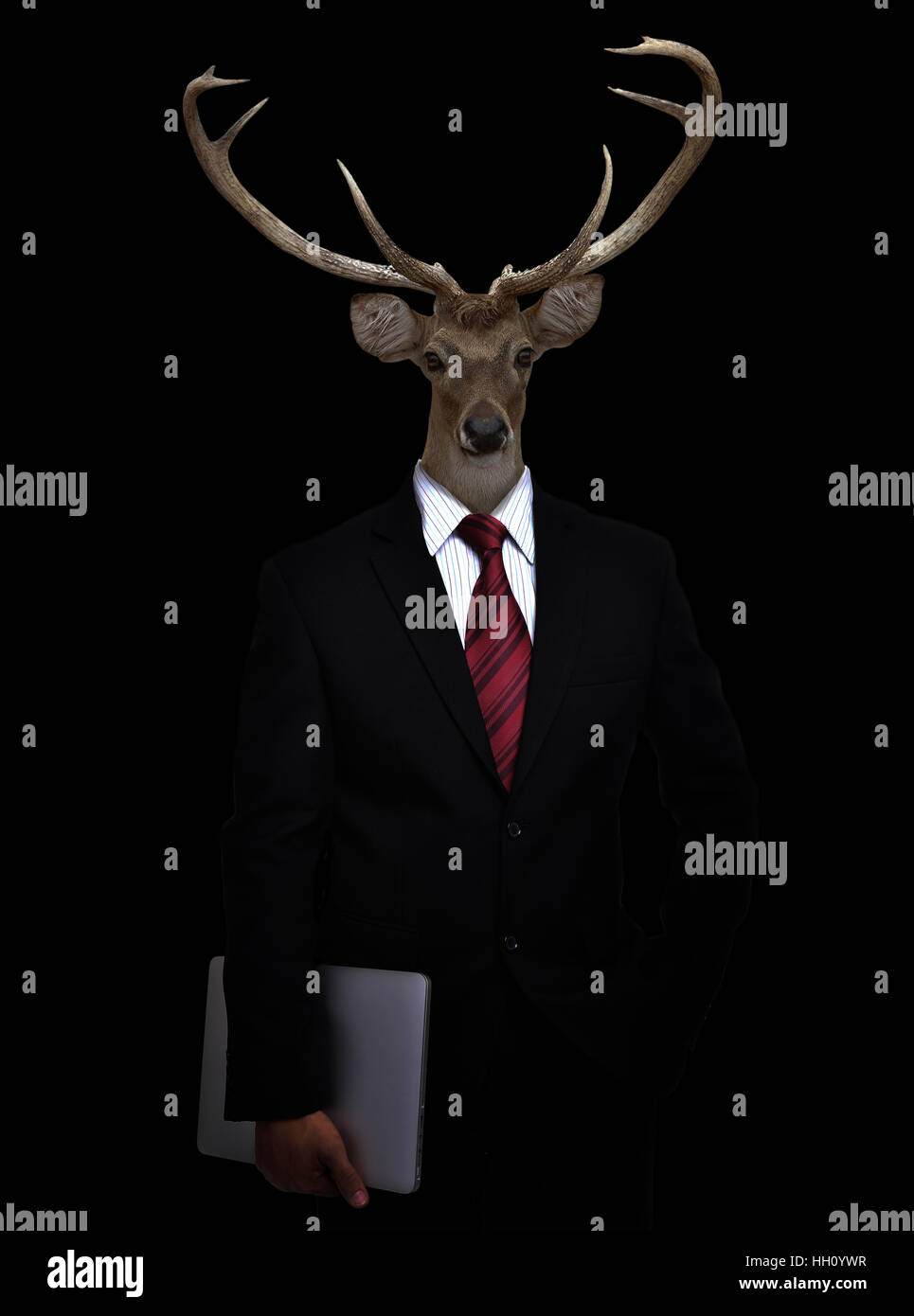 business man with deer head in the dark Stock Photo