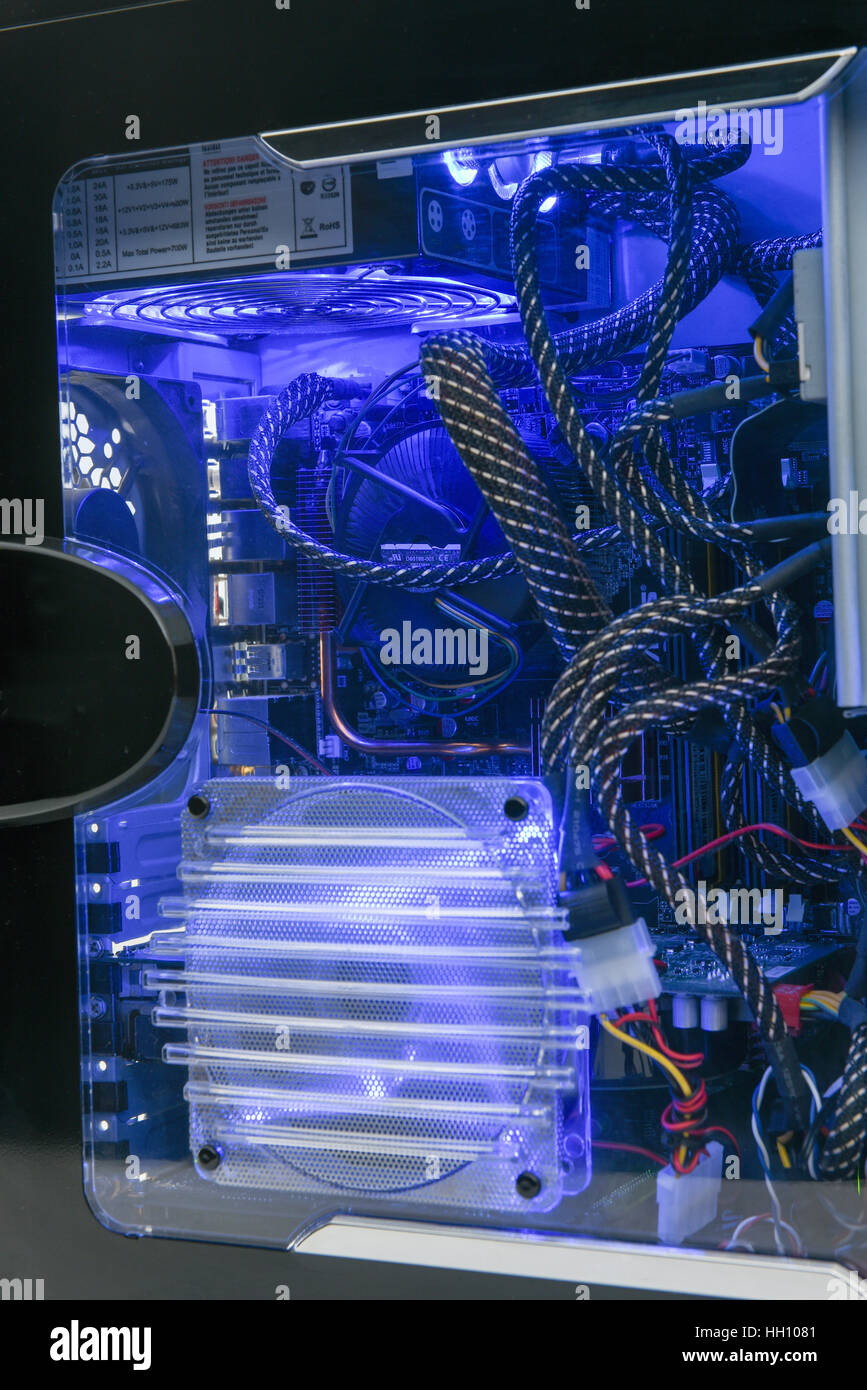 Illuminated computer hardware with a look inside the box Stock Photo ...