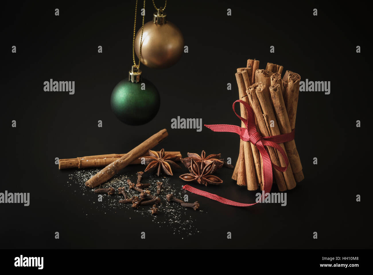 Cinnamon Sticks, Star anise and Cloves with two Christmas Baubles Stock Photo