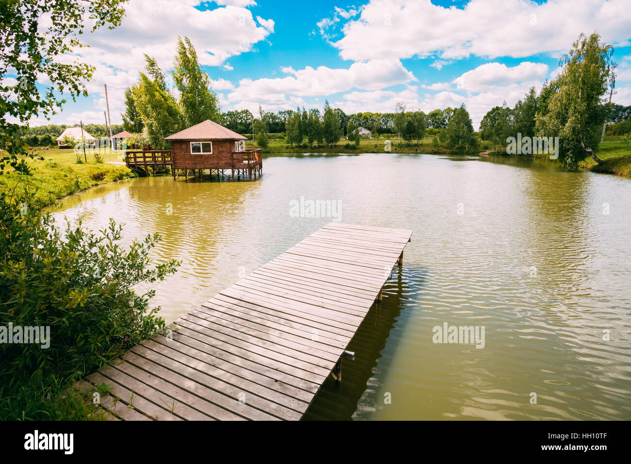 Old Wooden Pier For Fishing, Small House On Small Lake Or River