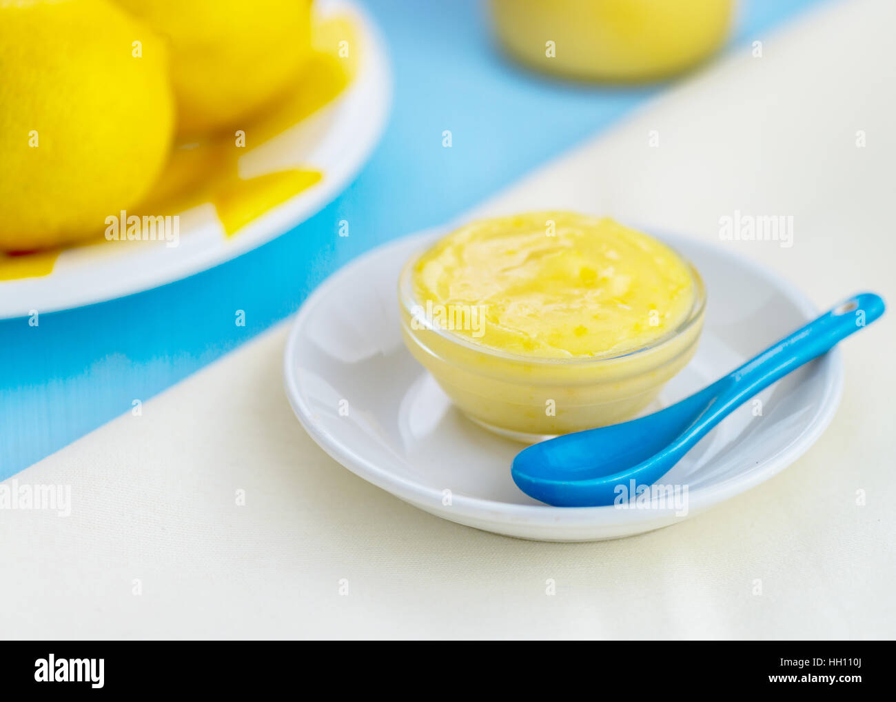 homemade lemon curd blue and yellow colors, blurred background for use of copy space Stock Photo