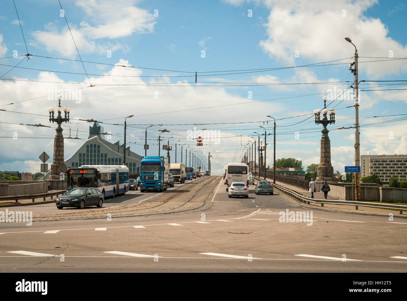 RIGA, LATVIA - JULY 31: View on busy road with car traffic on Akmens bridge with National library on background. July 2015 Stock Photo