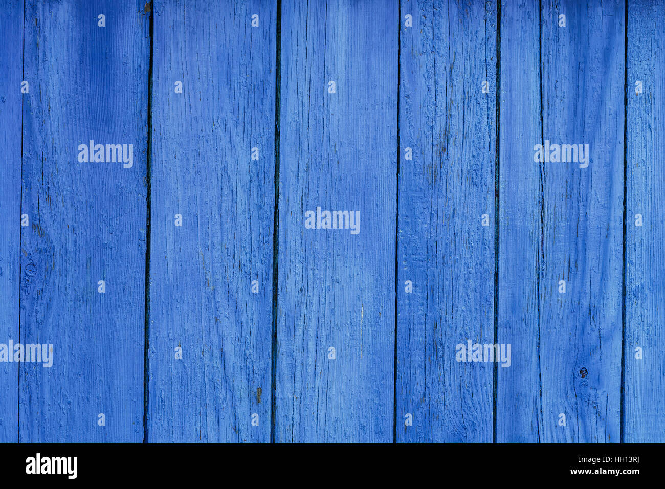 Weathered blue stained wood texture background. Fading blue painted wood  door Stock Photo