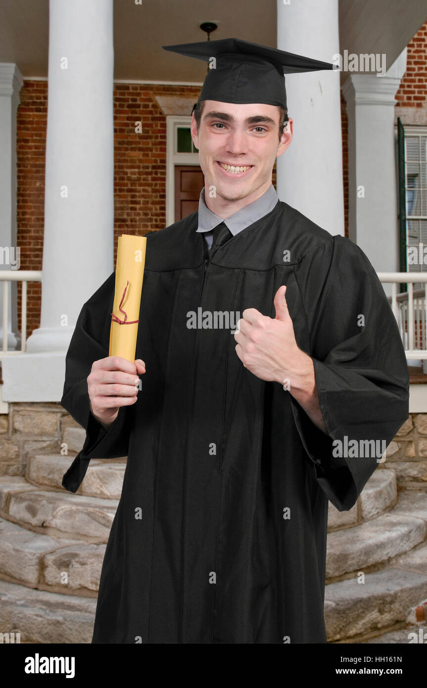 Young man in his graduation robes Stock Photo - Alamy