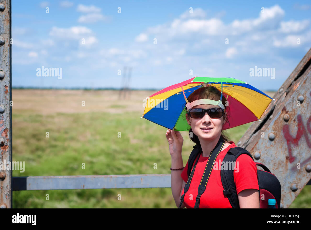 Woman wearing umbrella hat hi-res stock photography and images - Alamy