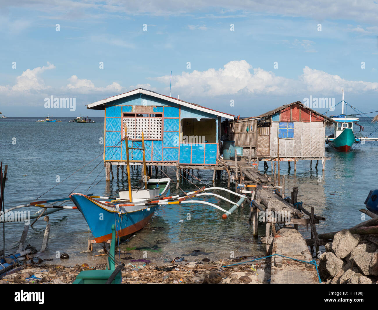 Fishing vessels and fishermen’s homes in Tinoto, a fishing village in Maasim, the province of Sarangani on Mindanao. Stock Photo