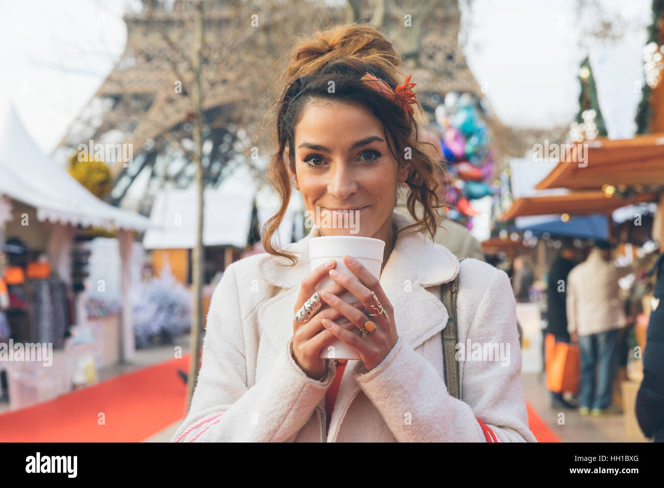 Paris, Woman doing shopping in Christmas market Stock Photo