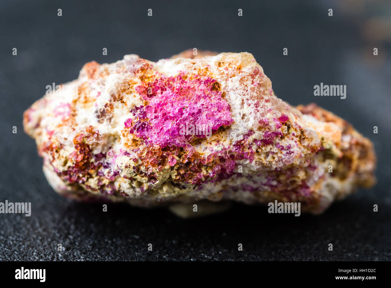 Pink and red ruby crystals in host mineral. Stock Photo