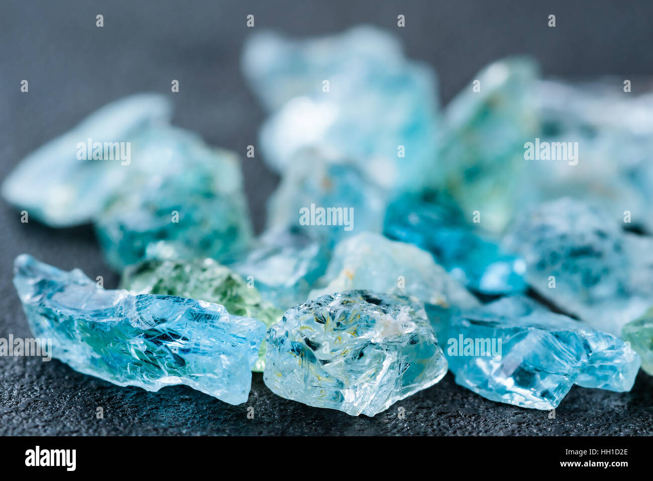 Collection of lovely blue uncut aquamarine gemstones. Stock Photo