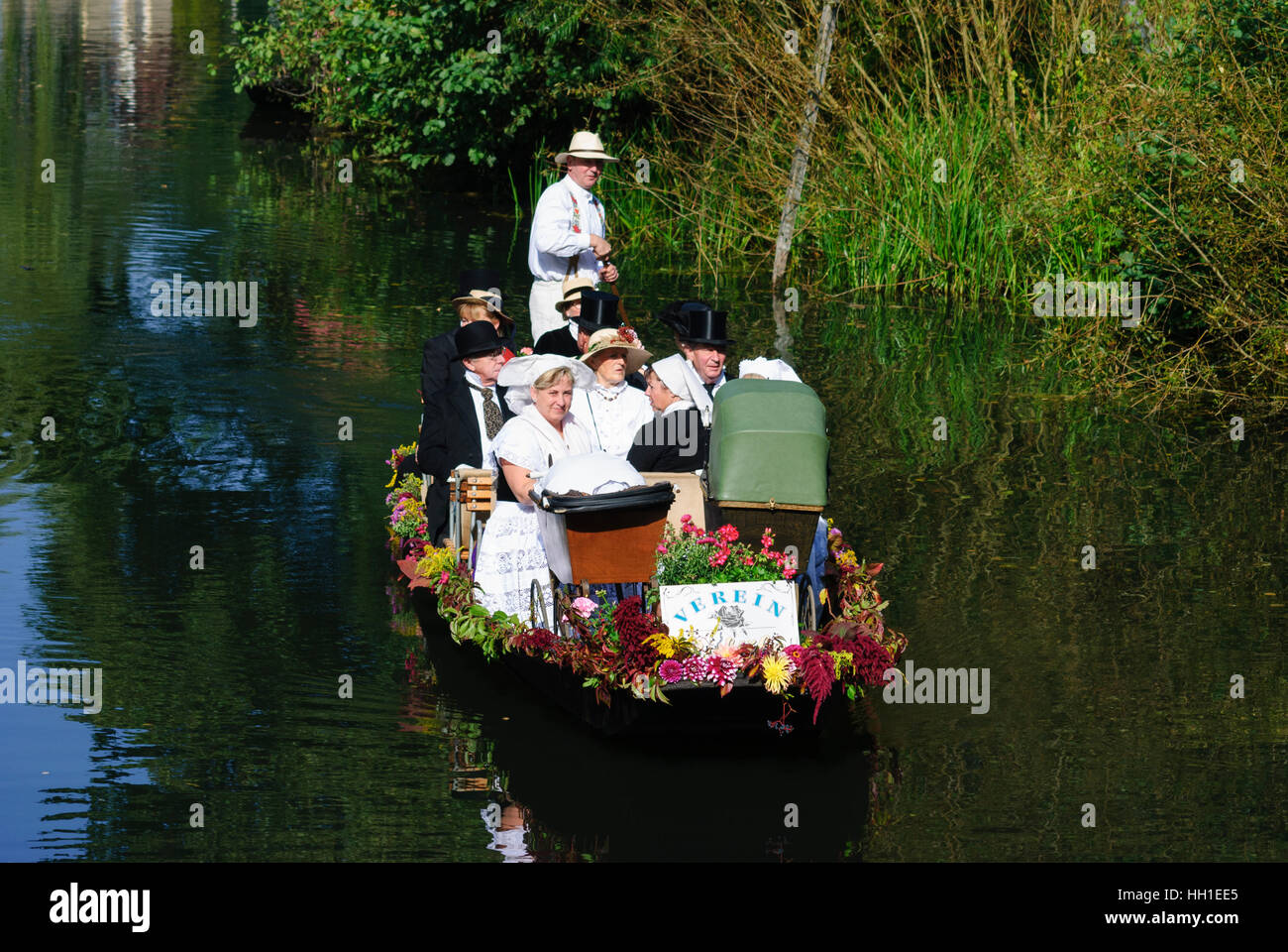 Lübbenau/Spreewald: Small boat with locals dressed in national costume on the journey to a party in the Spreewald, , Brandenburg, Germany Stock Photo
