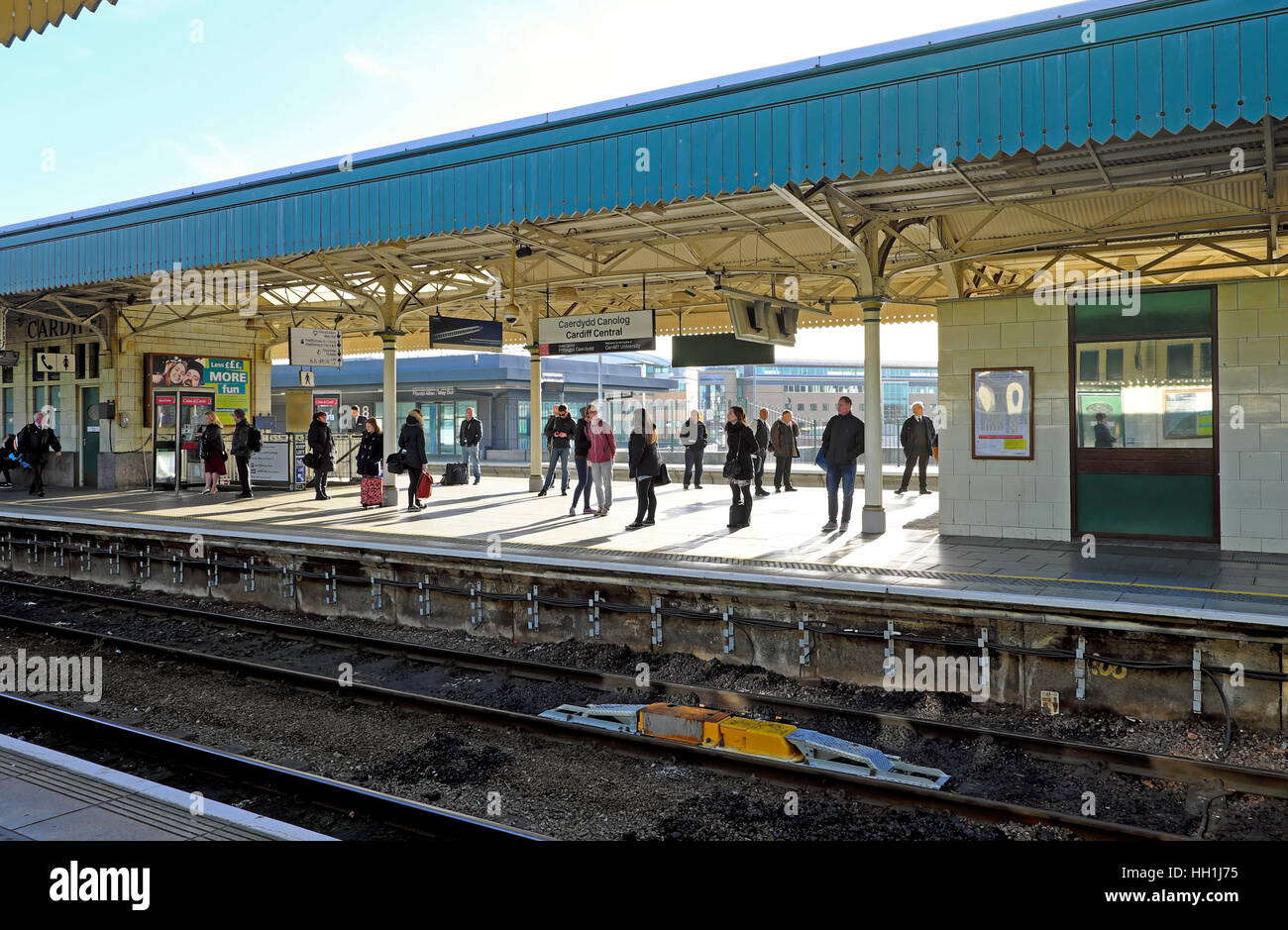 People standing on Cardiff City Rawilway Station platform in Wales UK  KATHY DEWITT Stock Photo